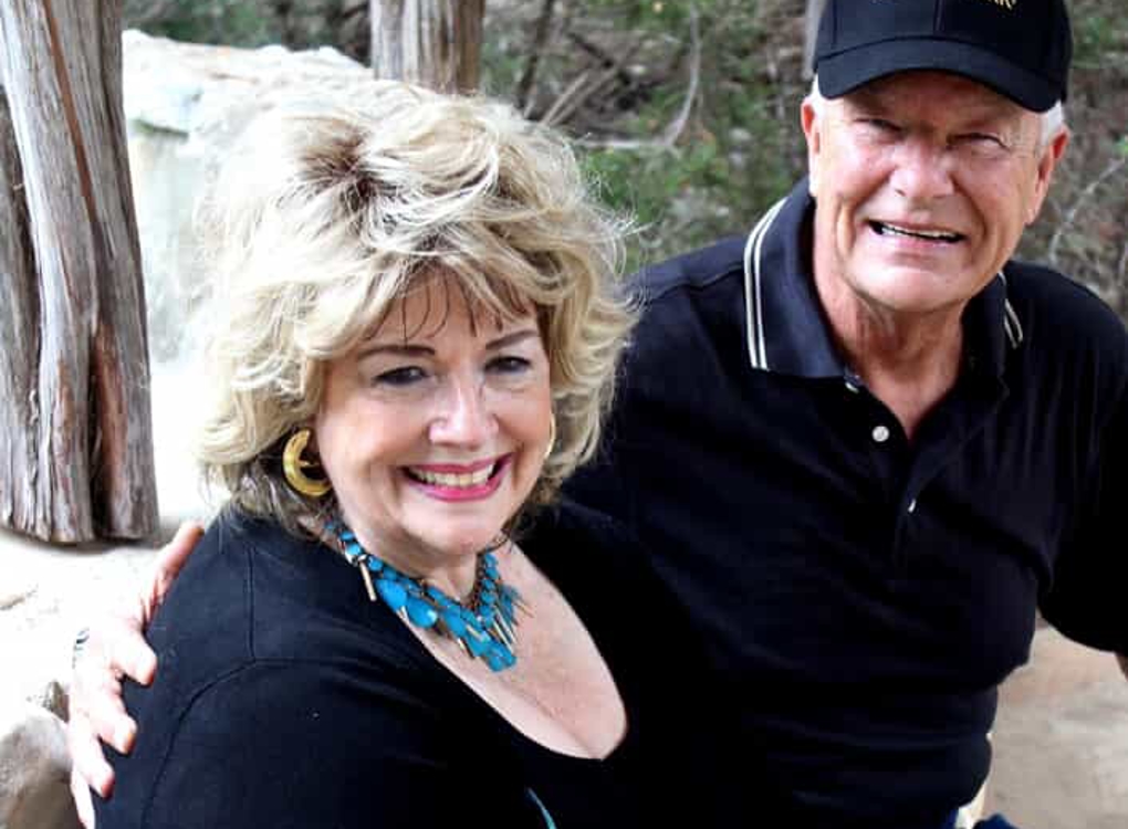 Husband and wife smiling at camera