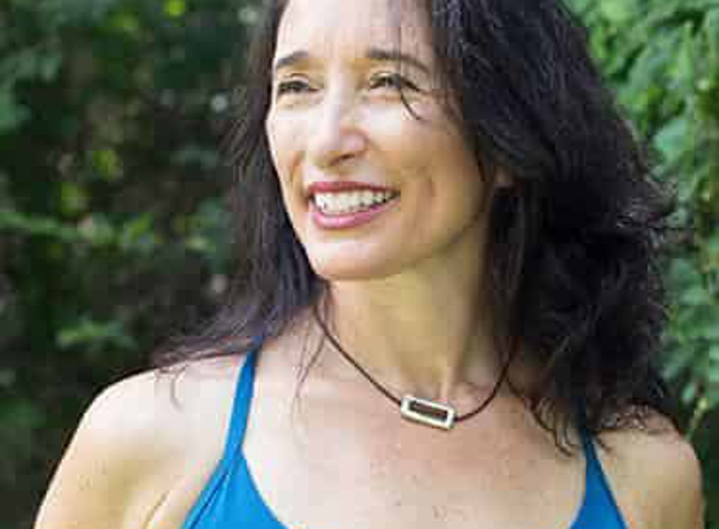 Woman in blue tank top smiling