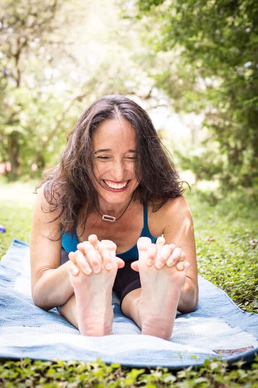 Woman stretching and touching her toes